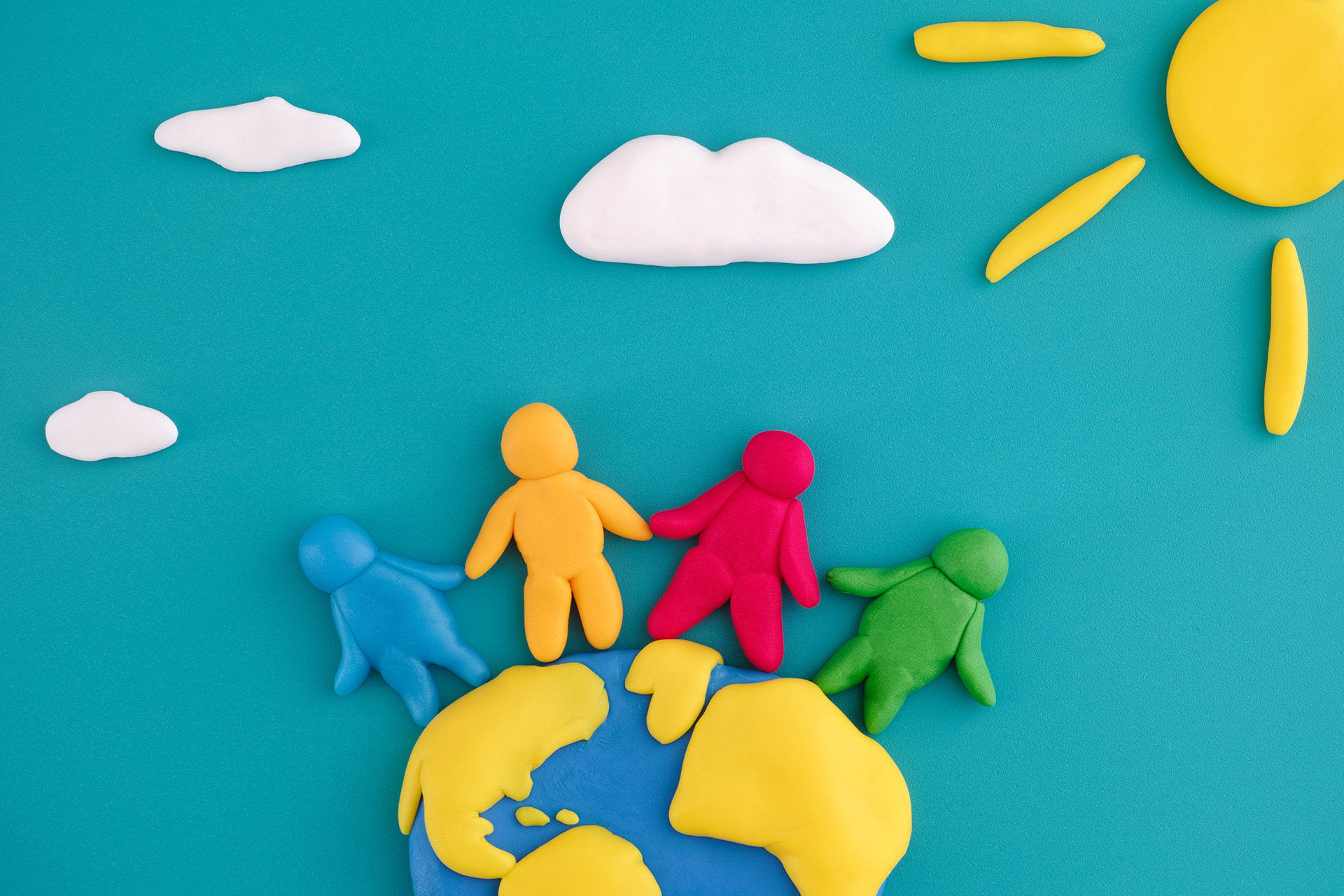 group of people around the world made of playdough